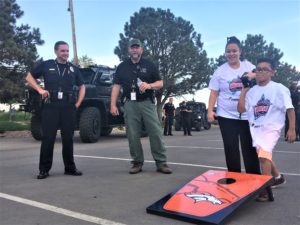 kids playing games and hanging out with firefighters and the police force