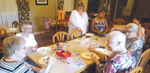 Seniors at Assisi Homes of Kenosha enjoyed working with a volunteer to make their own jewelry.