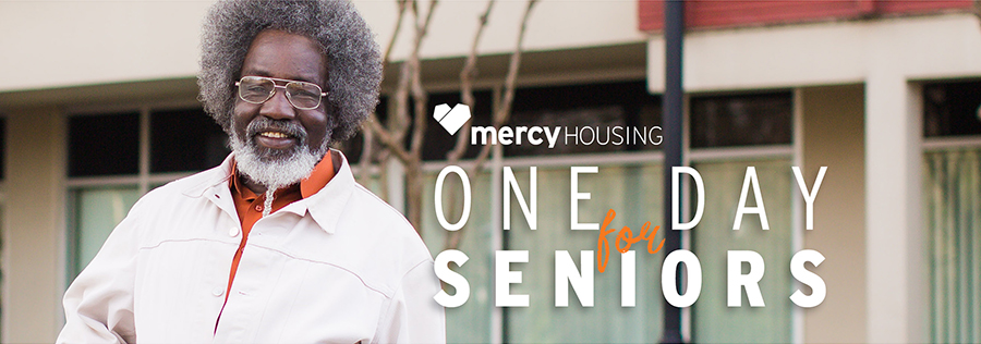 Senior man with afro hairstyle and orange shirt smiling. One Day for Seniors