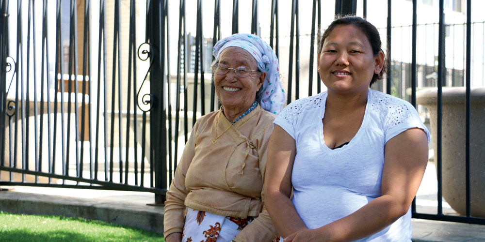 Residents outside of Grace Apartments in Denver