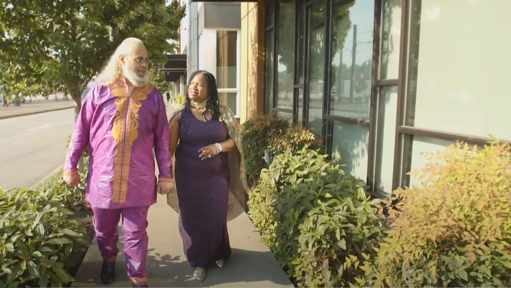 Allison and Mark holding hands and walking