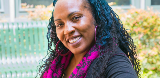 Headshot of smiling woman, Kai Bluford, who is our Resident Services Coordinator