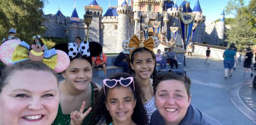 Family smiling at Disneyworld