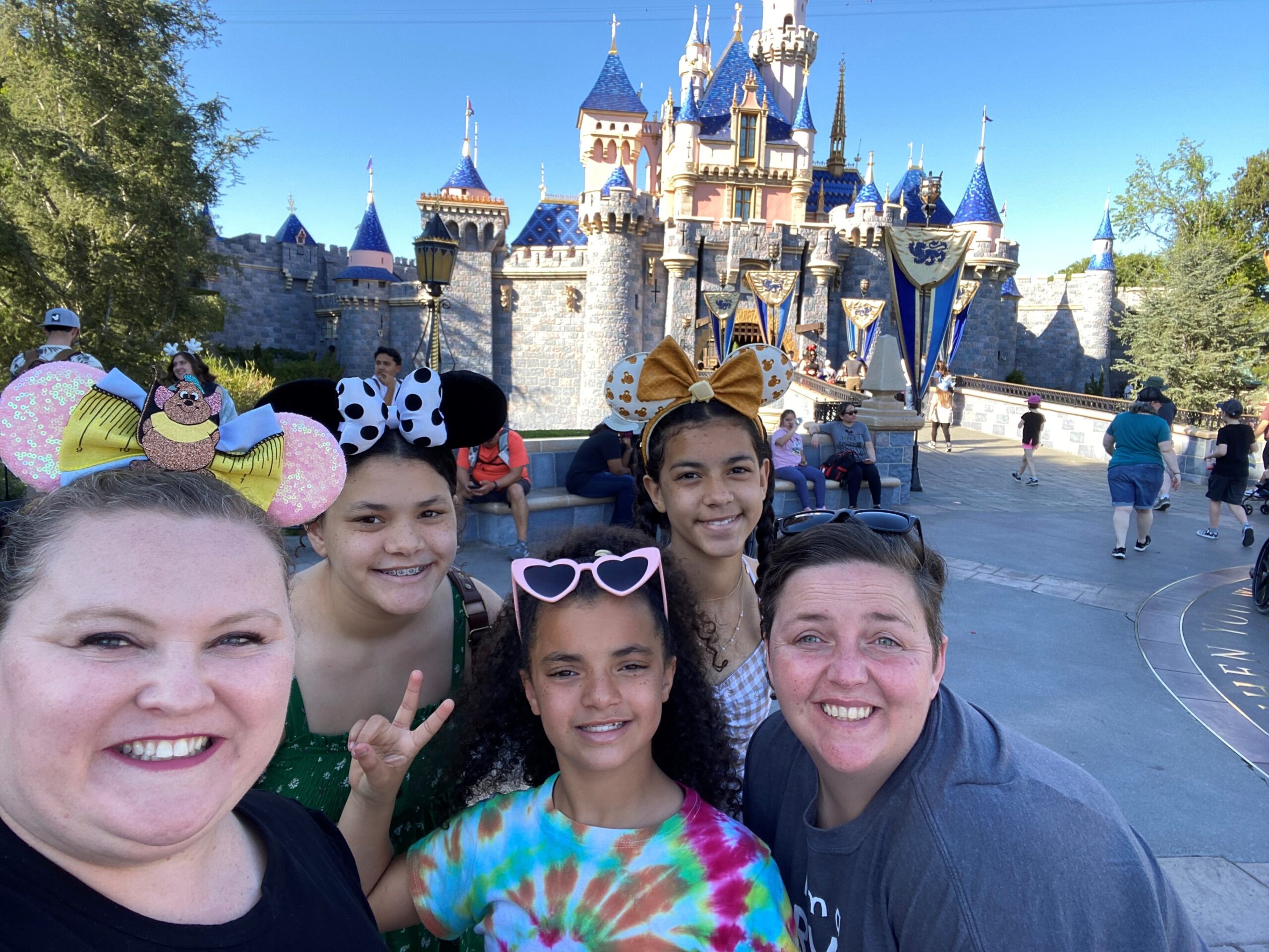 Family smiling at Disneyworld