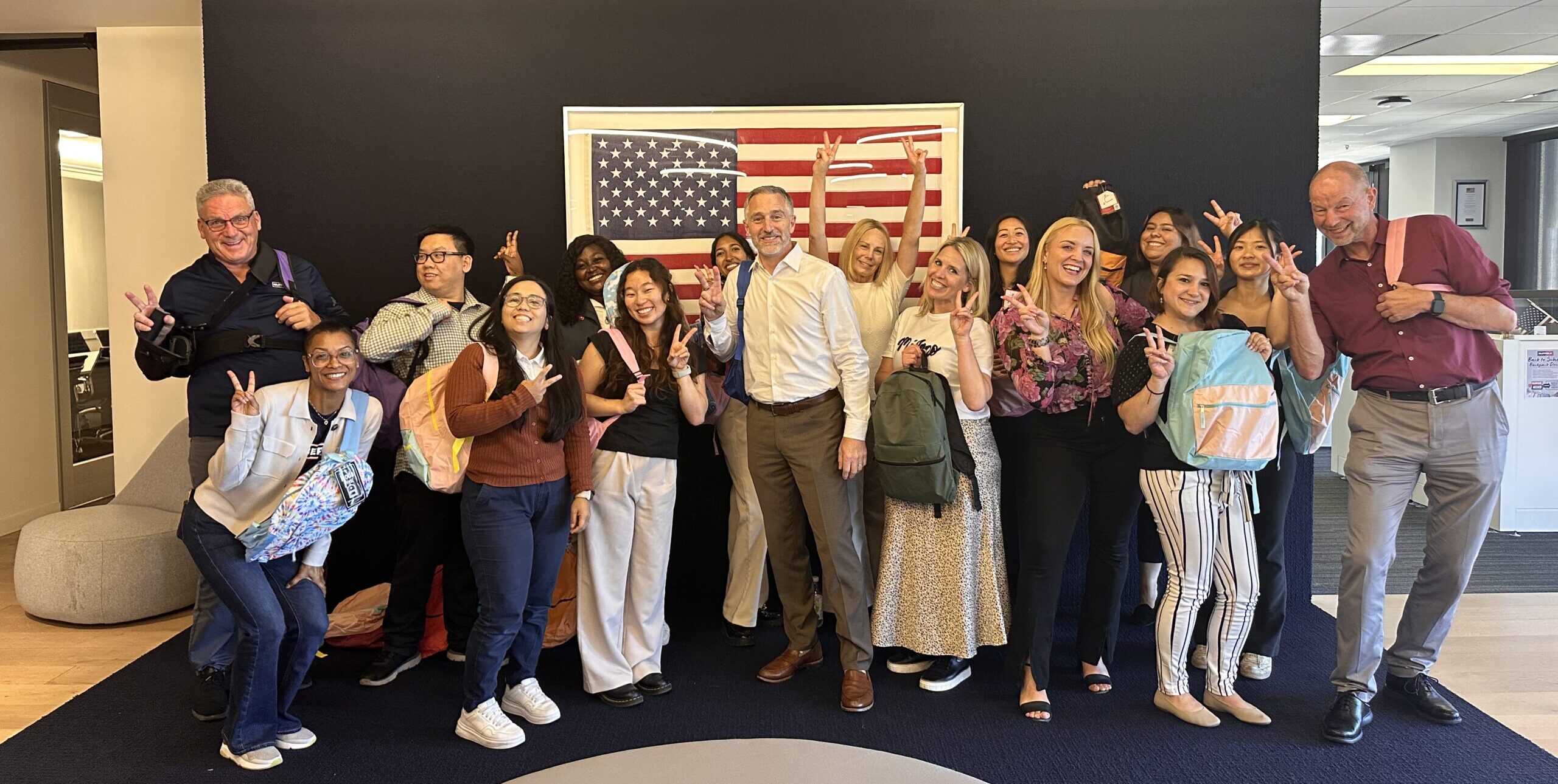 A group of people at the 600 Seventh Street Backpack Drive